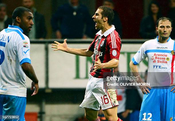 Milan's French midfielder Mathieu Flamini celebrates after scoring during the Italian Serie A football match between AC Milan and Catania on April...
