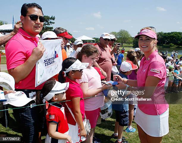 Paula Creamer signs autographs for fans during the final round of the 2013 North Texas LPGA Shootout at the Las Colinas Counrty Club on April 28,...