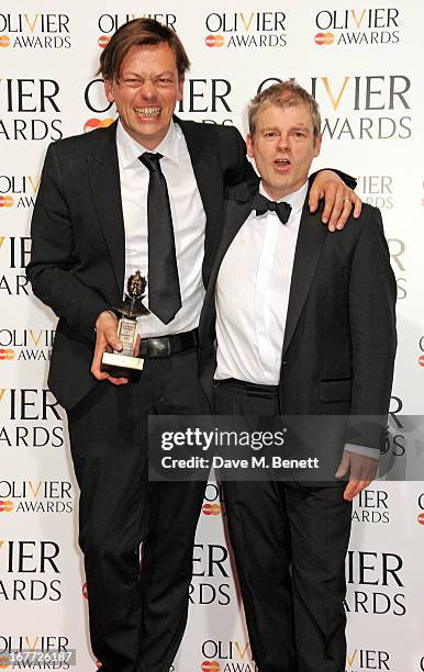 Simon Stephens and Mark Haddon, winners of the Mastercard Best New Play award for 'The Curious Incident Of The Dog In The Night-Time', pose in the...