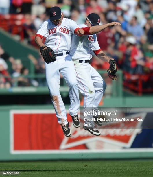 Jacoby Ellsbury and Daniel Nava of the Boston Red Sox celebrate a 6-1 win and a series sweep over the Houston Astros on April 28, 2013 at Fenway Park...