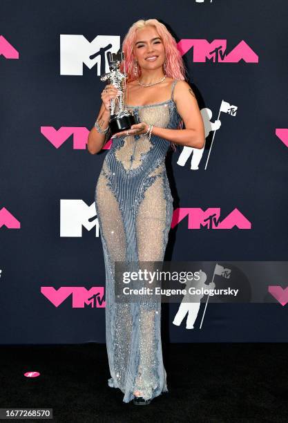 Karol G poses with the Best Collaboration award for "TQG" in the press room at the 2023 MTV Video Music Awards at Prudential Center on September 12,...