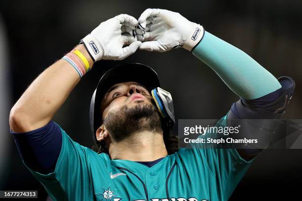 Eugenio Suarez of the Seattle Mariners celebrates his solo home run during the fifth inning against the Los Angeles Angels at T-Mobile Park on...