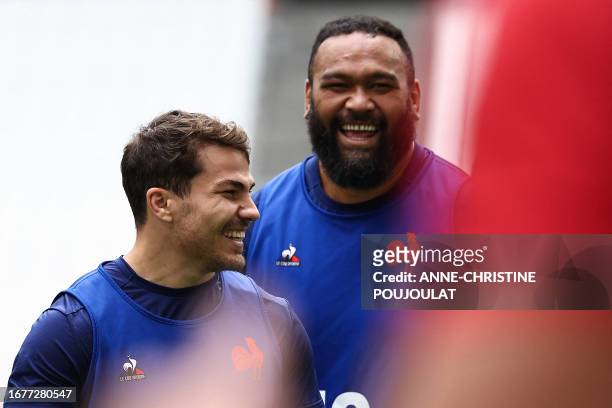 France's scrum-half Antoine Dupont and France's prop Uini Atonio take part in the captain's run training session at the Velodrome Stadium in...