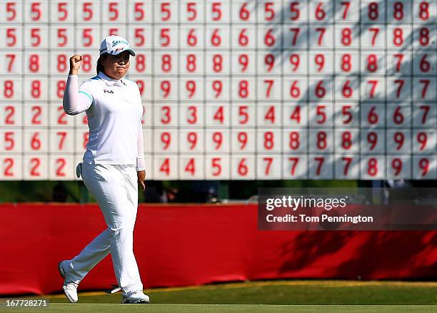 Inbee Park of South Korea celebrates after sinking a birdie putt during the final round to win the 2013 North Texas LPGA Shootout at the Las Colinas...