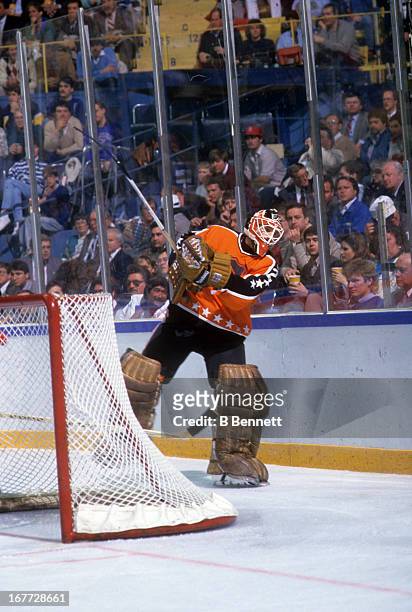 Goalie Ron Hextall of the Wales Conference and the Philadelphia Flyers passes the puck during the 1988 39th NHL All-Star Game against the Campbell...