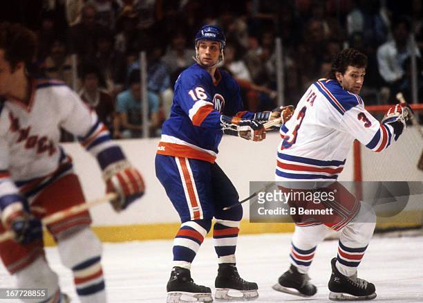 Mike McEwen of the New York Islanders defends against Barry Beck of the New York Rangers during an 1981 Stanley Cup Semi Finals game in May, 1981 at...