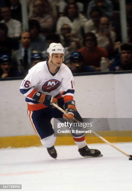 Mike McEwen of the New York Islanders skates with the puck during an 1981 Stanley Cup Semi Finals game against the New York Rangers in April, 1981 at...