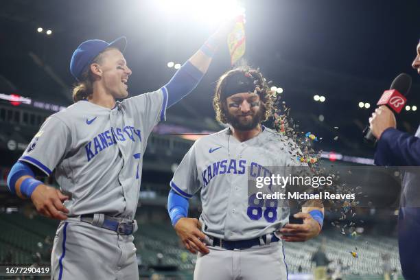 Bobby Witt Jr. #7 of the Kansas City Royals celebrates Logan Porter and his MLB debut after defeating the Chicago White Sox 11-10 at Guaranteed Rate...