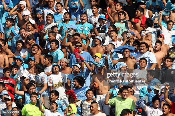 Supporters of Sporting Cristal cheer for their team during a match between Sporting Cristal and Universitario as part of the Torneo Descentralizado...