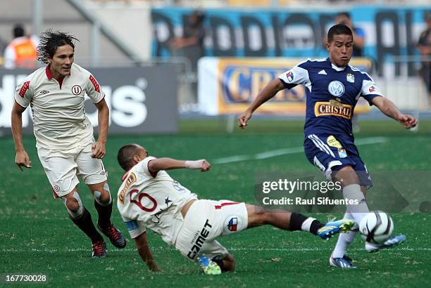 Marcio Valverde of Sporting Cristal fights for the ball with Rainer Torres of Universitario during a match between Sporting Cristal and Universitario...