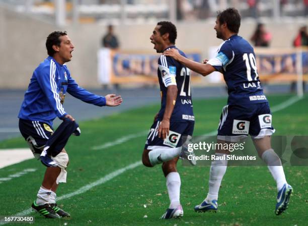 Players of Sporting Cristal celebrate a goal against Universitario during a match between Sporting Cristal and Universitario as part of the Torneo...