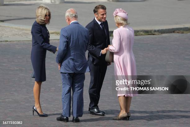 French President Emmanuel Macron and his wife wife Brigitte Macron welcome Britain's King Charles III and Britain's Queen Camilla for an official...