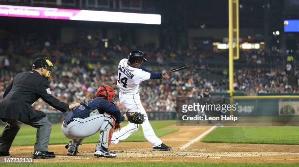 Austin Jackson of the Detroit Tigers hits a three-run home run in the third inning scoring Brayan Rena and Omar Infante during the game against the...