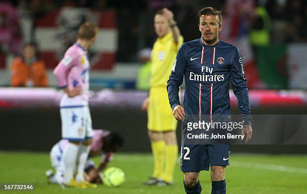 David Beckham of PSG reacts after receiving a direct red card from referee Olivier Thual during the Ligue 1 match between Evian Thonon Gaillard FC,...