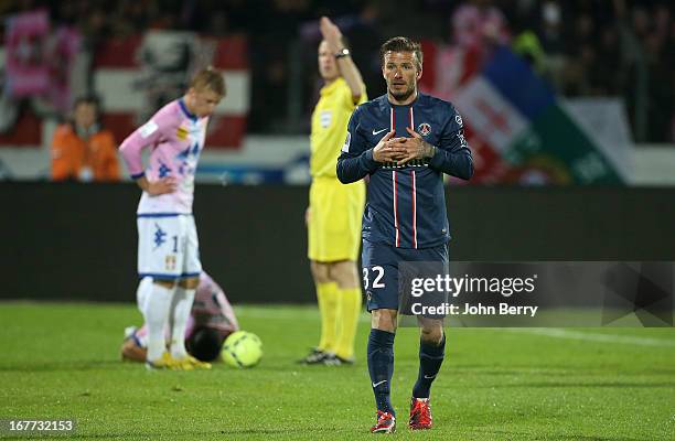 David Beckham of PSG reacts after receiving a direct red card from referee Olivier Thual during the Ligue 1 match between Evian Thonon Gaillard FC,...