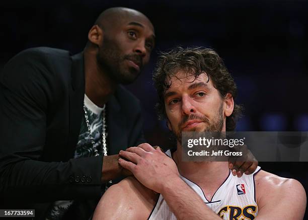 Pau Gasol of the Los Angeles Lakers is consoled by Kobe Bryant after coming out of the game in the second half against the San Antonio Spurs during...