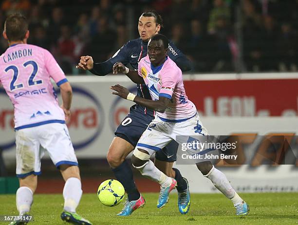 Zlatan Ibrahimovic of PSG and Mohammed Rabiu of ETG in action during the Ligue 1 match between Evian Thonon Gaillard FC, ETG, and Paris Saint Germain...