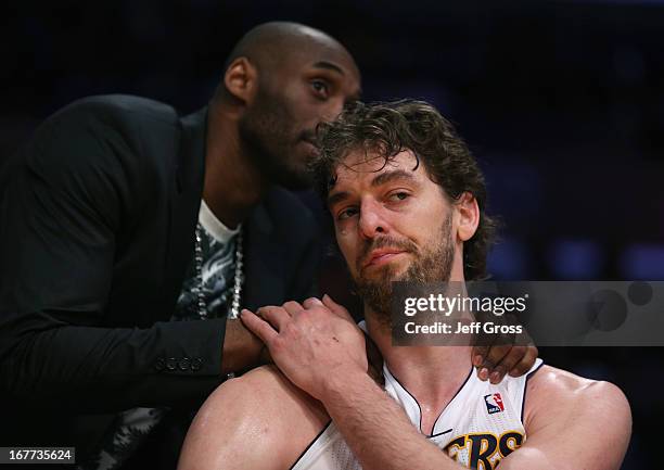 Pau Gasol of the Los Angeles Lakers is consoled by Kobe Bryant after coming out of the game in the second half against the San Antonio Spurs during...