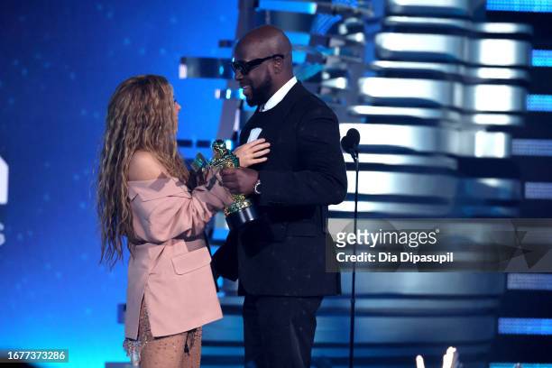 Shakira accepts the Michael Jackson Video Vanguard Award onstage from Wyclef Jean at the 2023 MTV Video Music Awards on September 12, 2023 in Newark,...