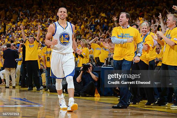 Stephen Curry of the Golden State Warriors celebrates with team majority owner Joe Lacob while playing against the Denver Nuggets in Game Four of the...