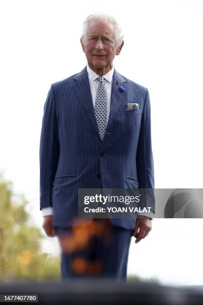 Britain's King Charles III stands to attention near the Tomb of the Unknown Soldier during an official welcoming ceremony at the Arc de Triomphe in...