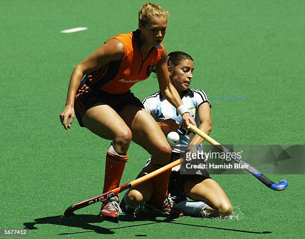 Lieve van Kessel for the Netherlands contests with Mariana Gonzalez Olivia for Argentina during the Women's World Cup Hockey gold medal match between...