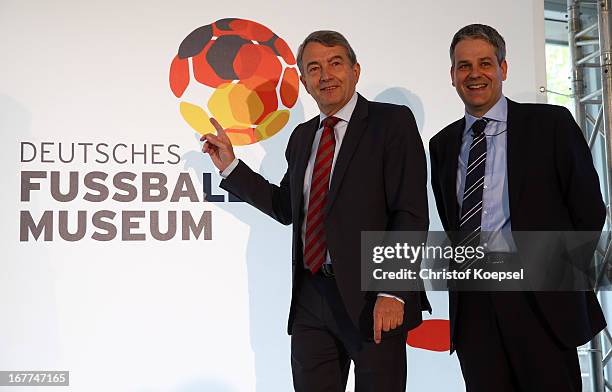 Wolfgang Niersbach, president of the German Football Association and Manuel Neukircher, director foundation DFB football museum pose in front of the...