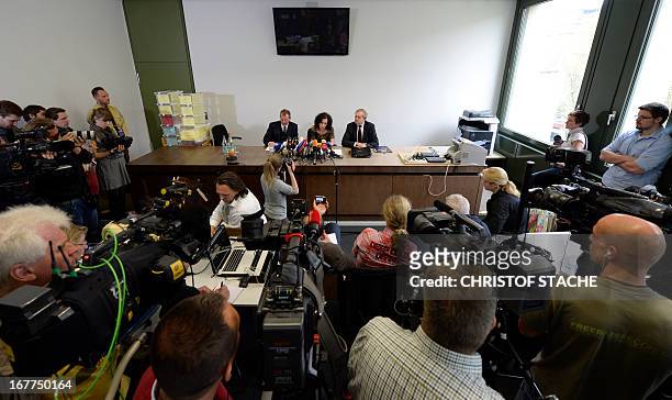 An overview shows journalists, camera teams as well as German notary Dieter Mayer and Karl Huber , President of the Higher Regional Court Munich ,...