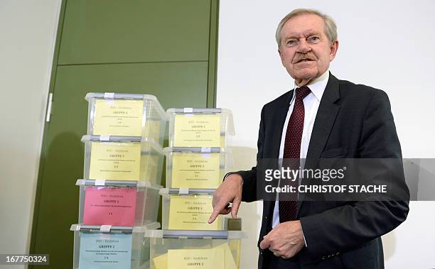 Karl Huber, President of the Higher Regional Court Munich , points to boxes filled with media demands during a press conference on April 29, 2013 in...