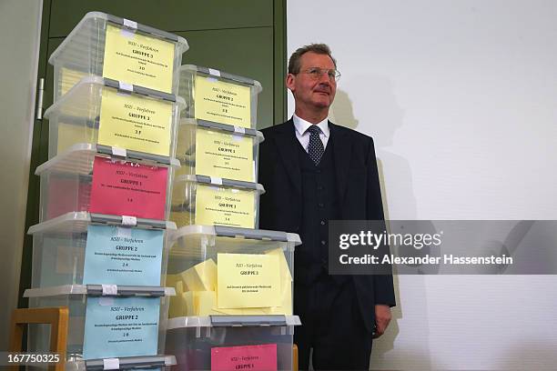 Notary Dr. Dieter Mayer stands next to the lottery boxes after a press conference following the lottery draw for the 50 media spots inside the...