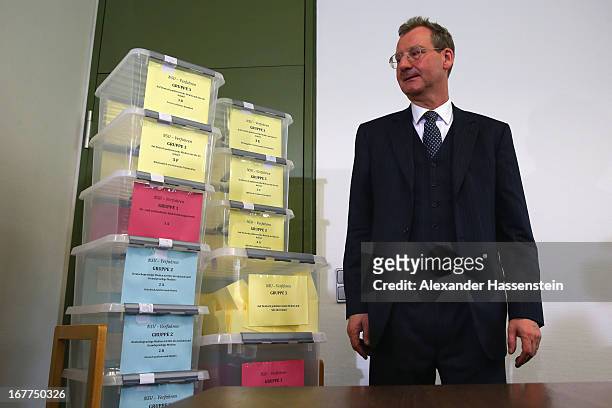 Notary Dr. Dieter Mayer stands next to the lottery boxes after a press conference following the lottery draw for the 50 media spots inside the...