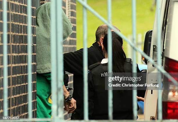 Mark Bridger leaves Mold Crown Court covered with a blanket after the first day of his trial accused of the murder of April Jones, on April 29, 2013...