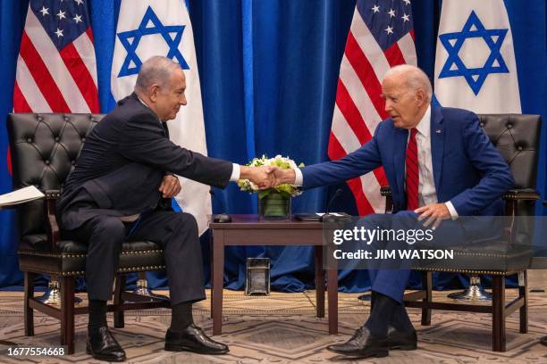 President Joe Biden shakes hands with Israeli Prime Minister Benjamin Netanyahu as they meet on the sidelines of the 78th United Nations General...