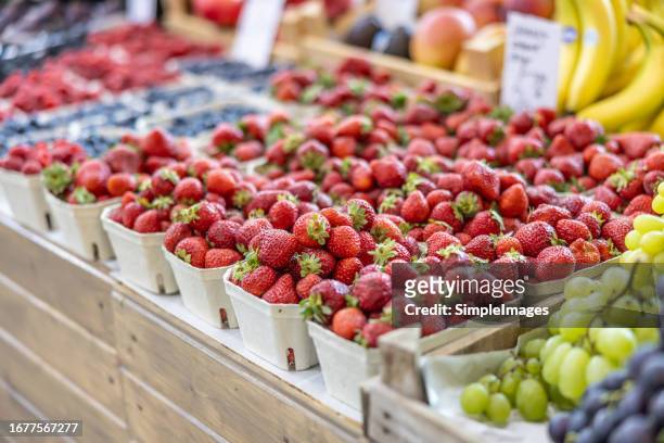 fresh strawberries ready for sale in wooden box at the farmers market. - fruit carton stock pictures, royalty-free photos & images