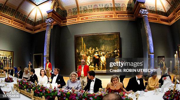 Queen Beatrix of the Netherlands hosts a dinner on April 29, 2013 at the National Museum in Amsterdam attended by Brunei's Crown Princess Sarah and...