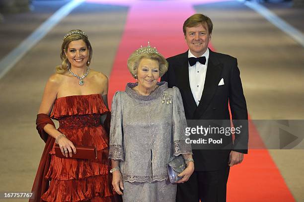 Princess Maxima of the Netherlands, Queen Beatrix of the Netherlands and Prince Willem-Alexander of the Netherlands arrive at a dinner hosted by...