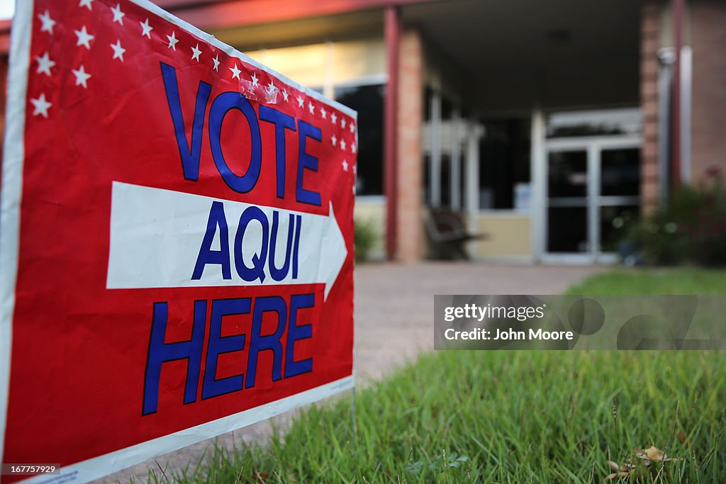 English-Spanish Signs Front Election Center In Texas