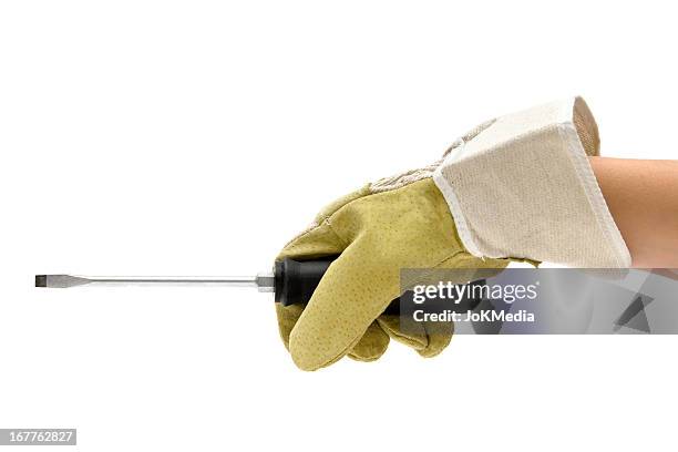 worker holding a screwdriver - screwdriver stock pictures, royalty-free photos & images