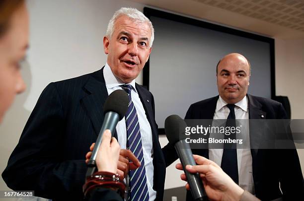 Alessandro Profumo, chairman of Banca Monte dei Paschi di Siena SpA, left, speaks while Fabrizio Viola, chief executive officer of Banca Monte dei...