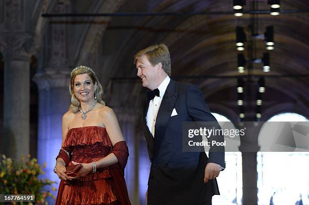 Princess Maxima of the Netherlands and Prince Willem-Alexander of the Netherlands arrive at a dinner hosted by Queen Beatrix of The Netherlands ahead...