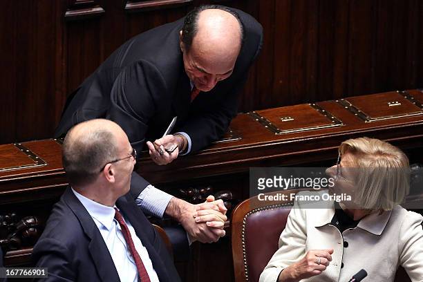 New Italian Prime Minister Enrico Letta receives congratulations from out-going Italy's Democratic Party general secretary Pier Luigi Bersani during...