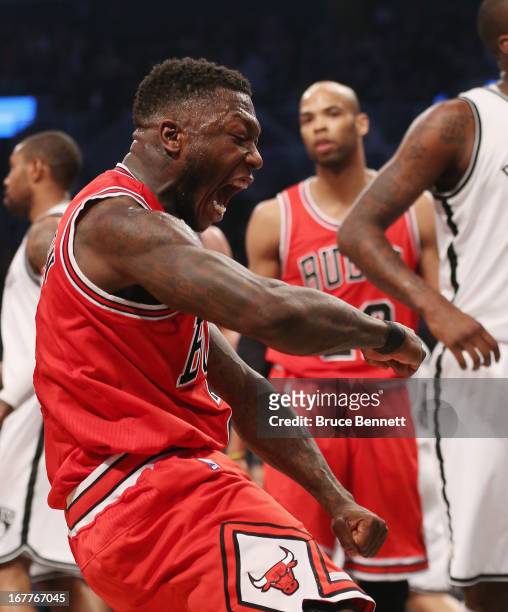 Nate Robinson of the Chicago Bulls sinks a basket and draws a fould against the Brooklyn Nets during Game Five of the Eastern Conference...