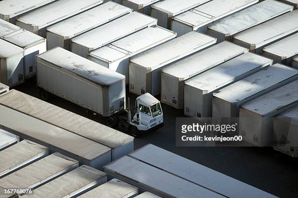 loading docks - convoy stock pictures, royalty-free photos & images