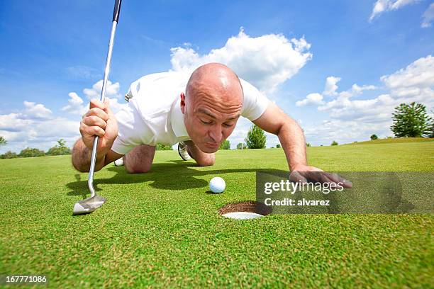 golfer cheating - golf cheating stock pictures, royalty-free photos & images