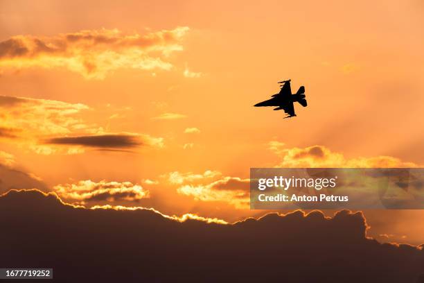 fighter aircraft at sunset. military aviation - missile defense command stock pictures, royalty-free photos & images