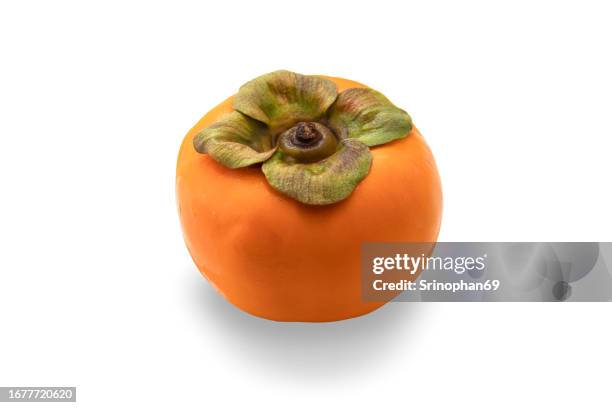 fresh yellow-orange persimmons - exotic tropical fruits for healthy snacking - persimmon stock pictures, royalty-free photos & images