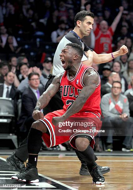 Chicago Bulls' Nate Robinson celebrates his basket and a foul during 2nd-quarter action against the Brooklyn Nets in Game 5 of the NBA Eastern...