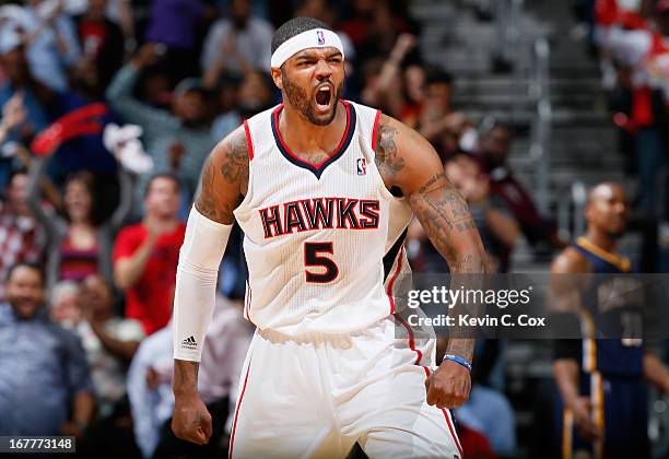 Josh Smith of the Atlanta Hawks reacts after a basket in the final minutes of their 102-91 win over the Indiana Pacers during Game Four of the...