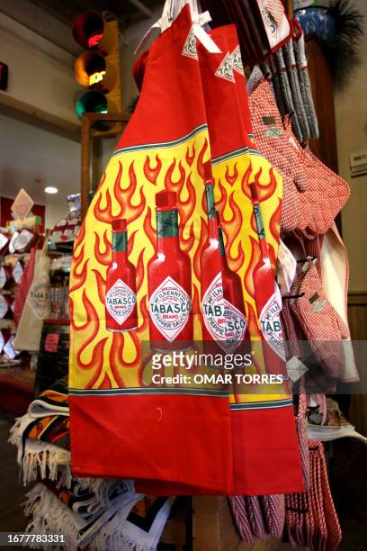 Chef aprons with tabasco sauce bottles are sold at the store at the McIlhenny Company in Avery Island, Lousiana, 14 September 2005. The famous...