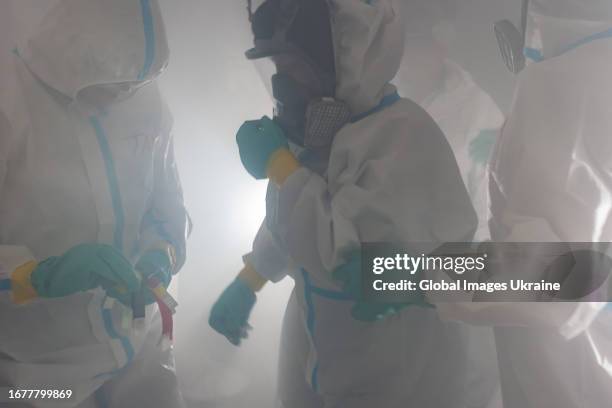 Participants of training take part in chemical, biological, radiological, nuclear and explosive exercises on September 5, 2023 in Dnipro, Ukraine....